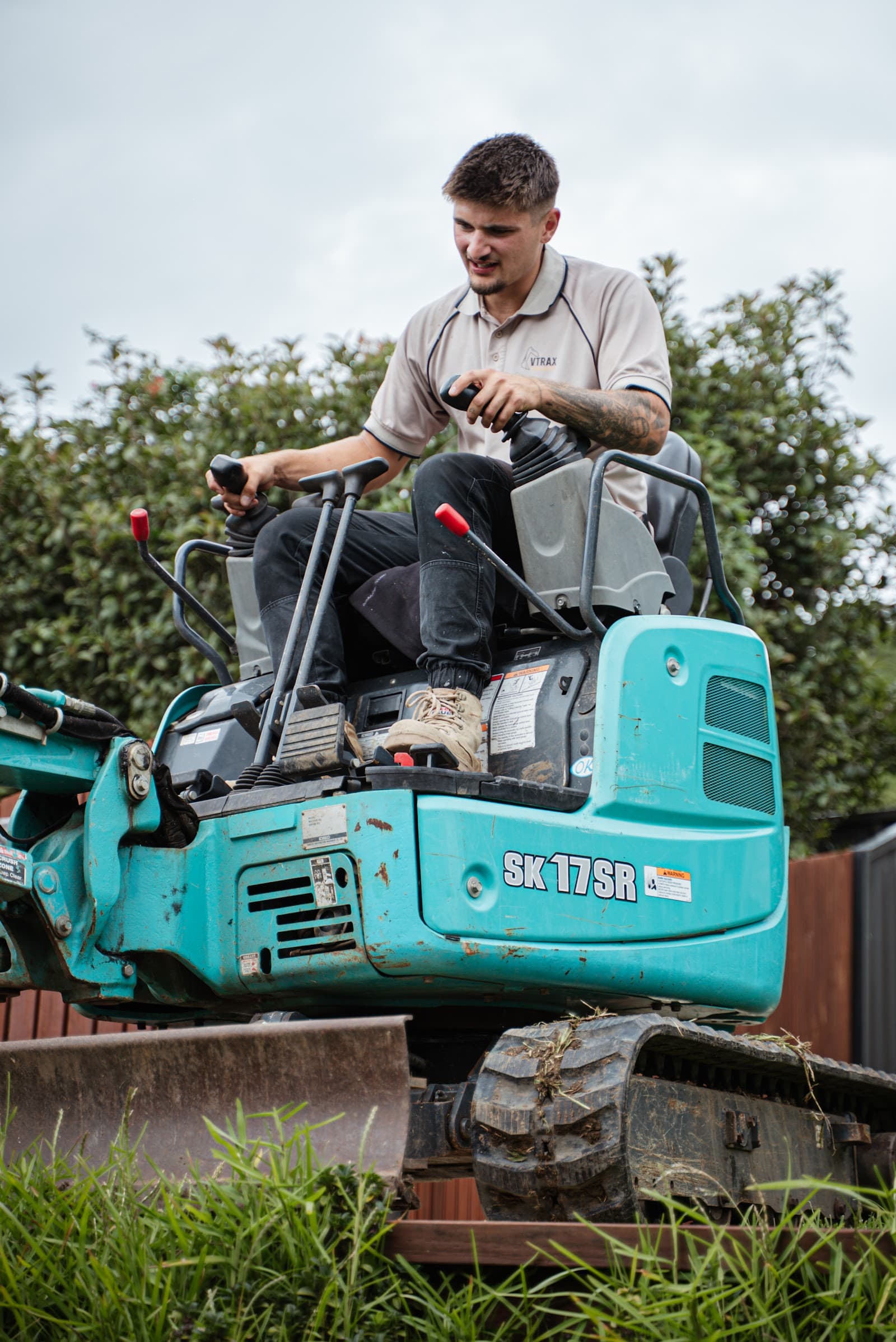Operator running the Kobelco SK17SR mini excavator